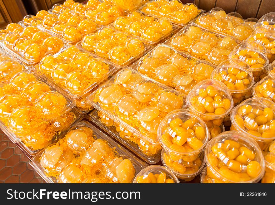 Traditional Thai Dessert in plastic box on shelf .Egg yoke fudge balls cooked in syrup, Golden threads, Bean-paste,. Traditional Thai Dessert in plastic box on shelf .Egg yoke fudge balls cooked in syrup, Golden threads, Bean-paste,