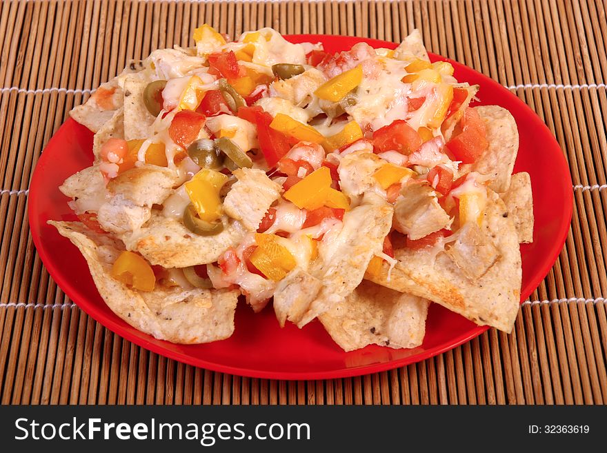 Cheese and chicken nachos plate