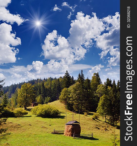 Summer landscape with haystack in the mountain village. Summer landscape with haystack in the mountain village