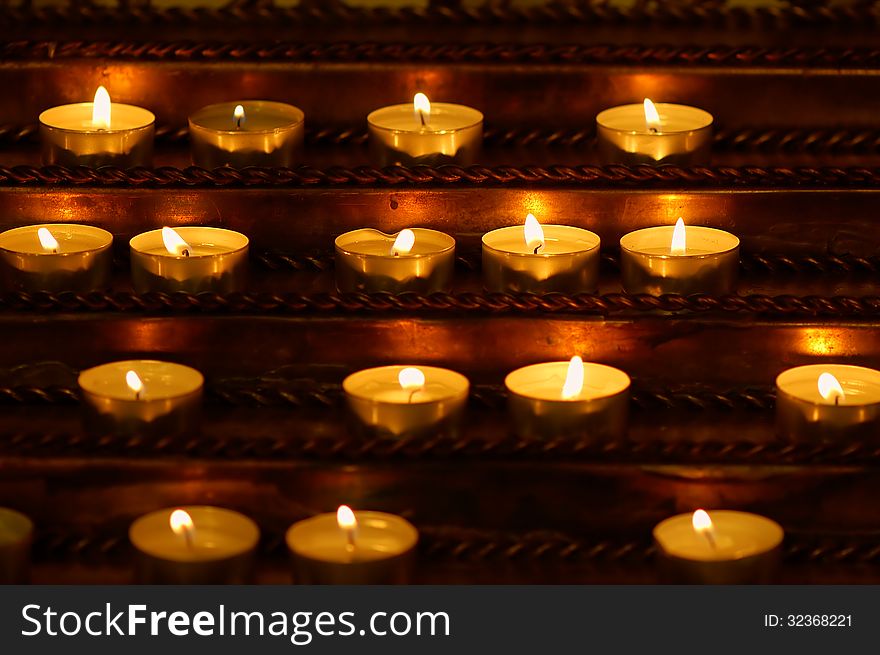 Burning candles in the Catholic Church
