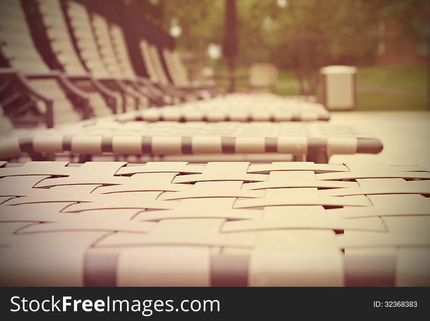 Row of deck chairs by the pool