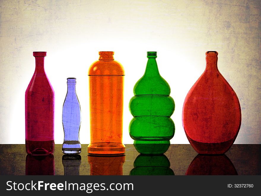 Isolated Glassware Lit from Behind. Various colors, different sizes.