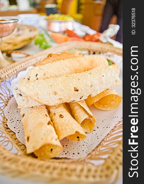 Deep fried indian bread or papads in basket