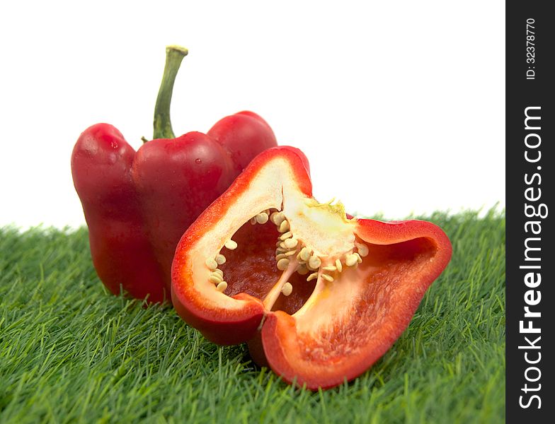 Cross section pepper on a green grass