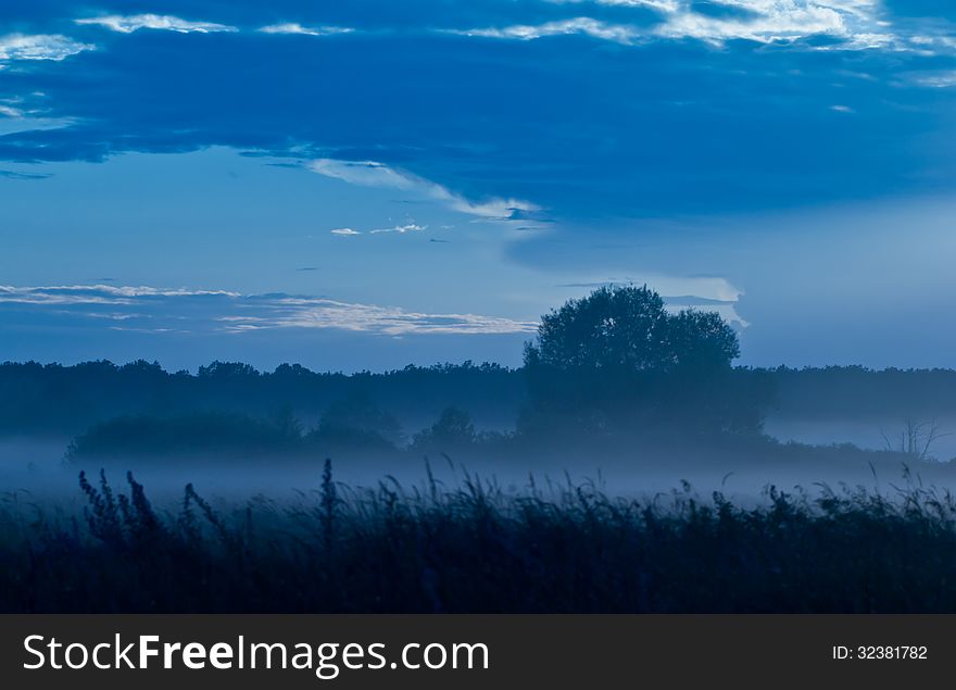 Blue fog in a valley after sunset. Blue fog in a valley after sunset