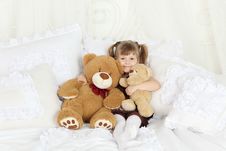 Little Girl Sits Bed With Pillows And Teddy Bears Royalty Free Stock Photo Little Girl Sits Bed With Pillows And Teddy Bears Royalty Free Stock Photo
