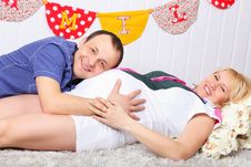 Happy Pregnant Wife And Husband Lie On Carpet Stock Image Happy Pregnant Wife And Husband Lie On Carpet Stock Image