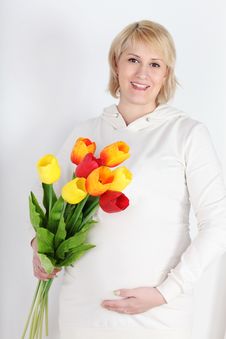 Happy Pregnant Woman In White With Bouquet Of Tulips Royalty Free Stock Image Happy Pregnant Woman In White With Bouquet Of Tulips Royalty Free Stock Image