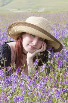Girl Dreaming In Violet Flowers Royalty Free Stock Photography