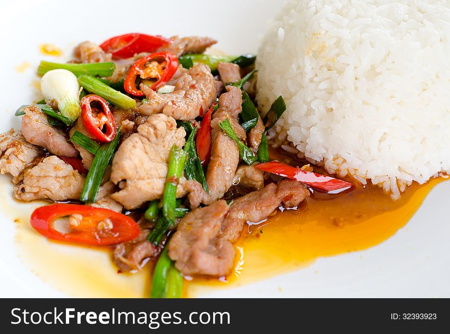 Pork fried with chilies and rice