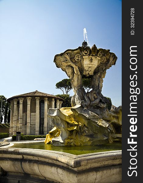 View of fountain of Tritons and Temple of Ercole in front of the Bocca della VeritÃ  in Rome, Italy. View of fountain of Tritons and Temple of Ercole in front of the Bocca della VeritÃ  in Rome, Italy.