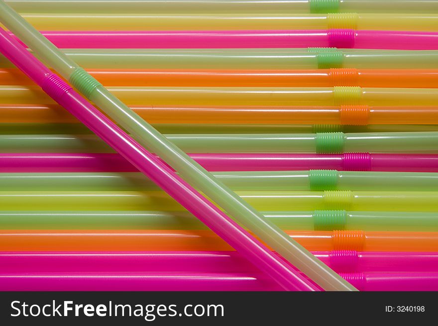 Many multi-coloured straws for juice