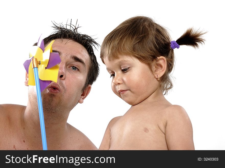 Picture of happy family - father with daughter play with pinwheel