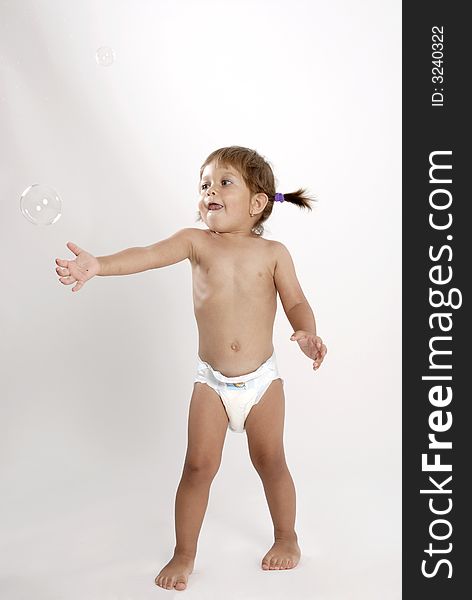 Picture of girl in nappies playing with bubbles. Picture of girl in nappies playing with bubbles