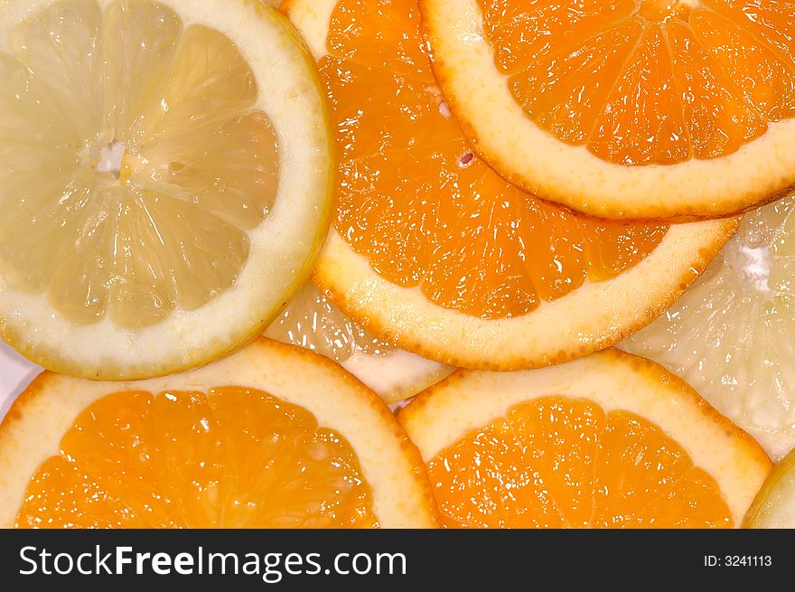 Slices of lemon an orange. Slices of lemon an orange