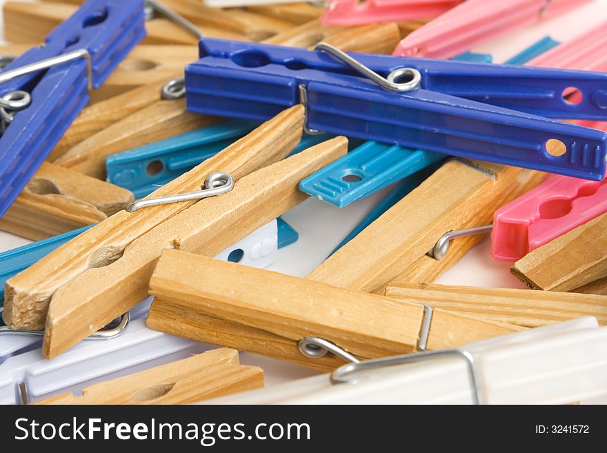 Colorful clothespin scattered around isolated on a white background. Colorful clothespin scattered around isolated on a white background