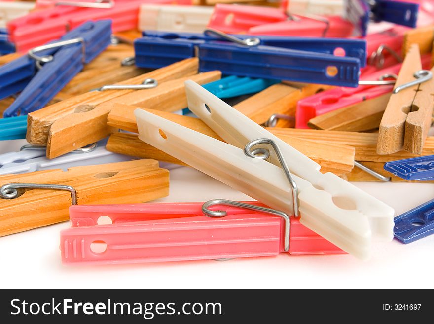 Colorful clothespin scattered around isolated on a white background. Colorful clothespin scattered around isolated on a white background