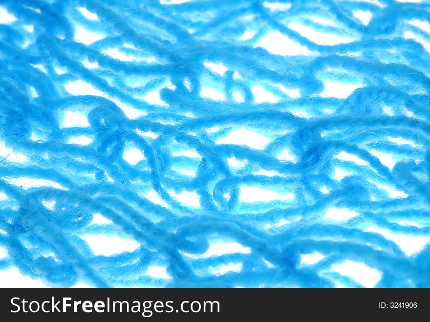 Blue yarn on white background