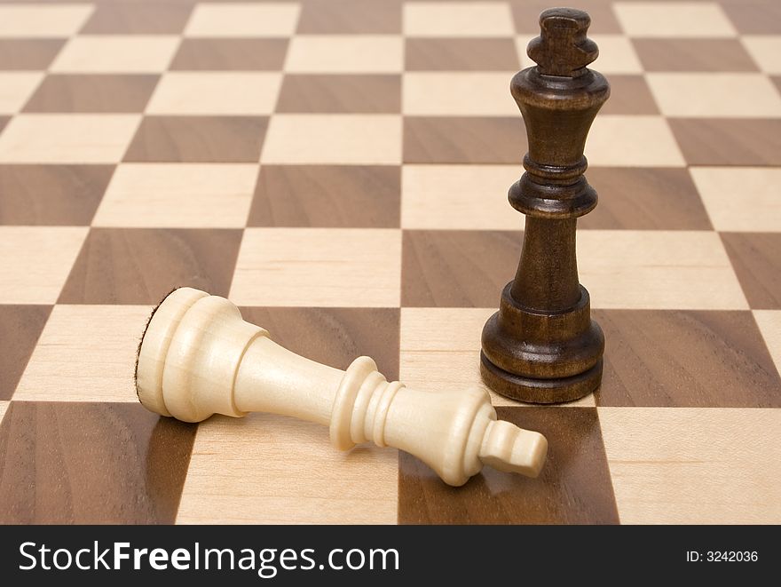 Two chess figures on a chess board, checkmate. Two chess figures on a chess board, checkmate