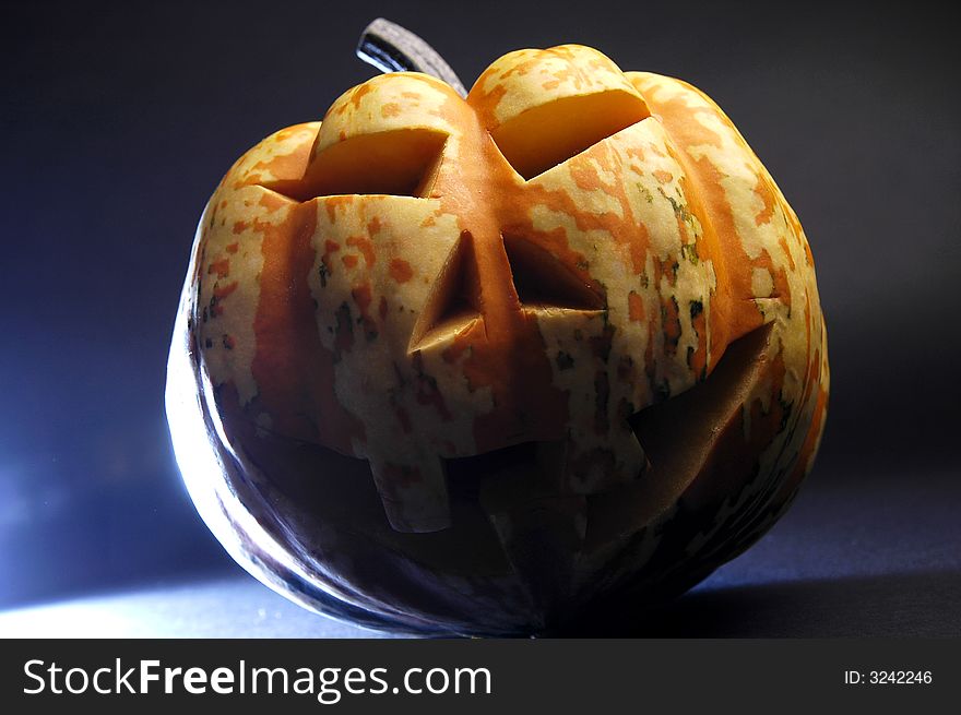 A scary-looking carved pumpkin for Halloween. A scary-looking carved pumpkin for Halloween