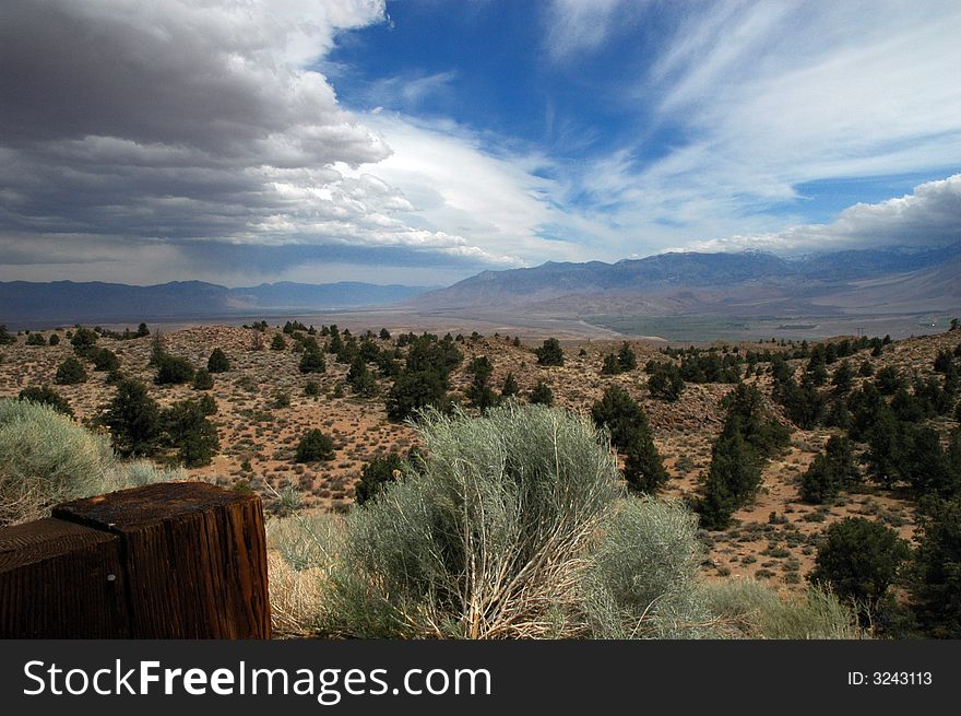 A desert landscape with dramatic sky and colors in California near the city of Bishop.