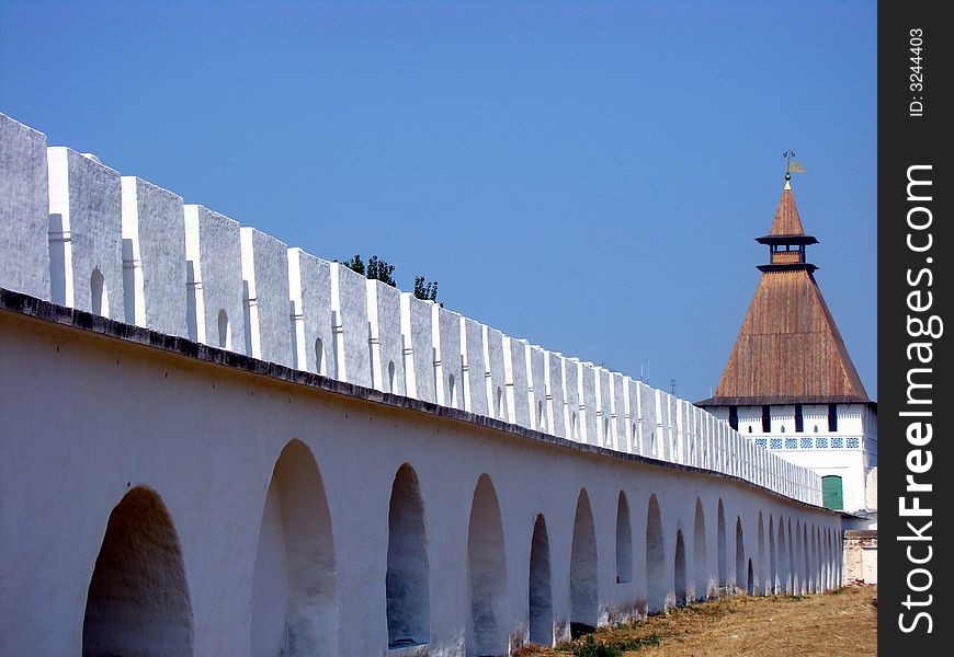 Protective wall of the ancient Kremlin in old city of Russia. It is a monument of architecture of 13 centuries