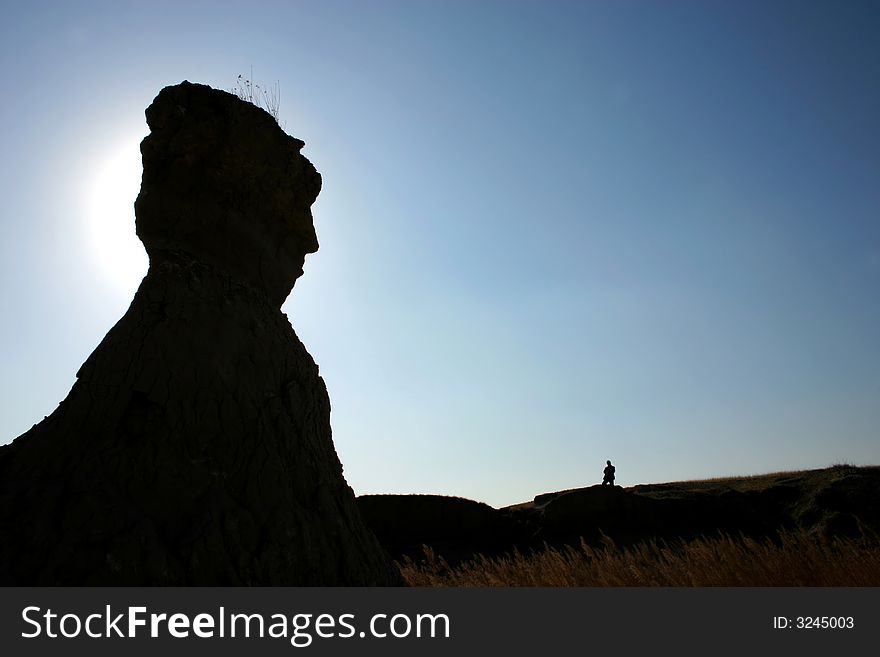 Human stone shadow and with one person standing beside it. Human stone shadow and with one person standing beside it