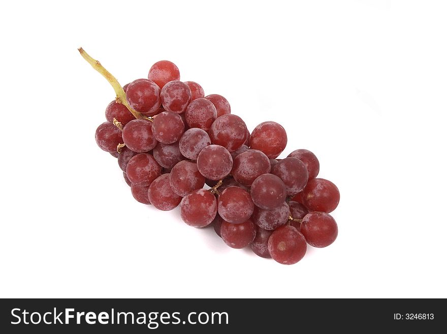 Red grapes on the white background