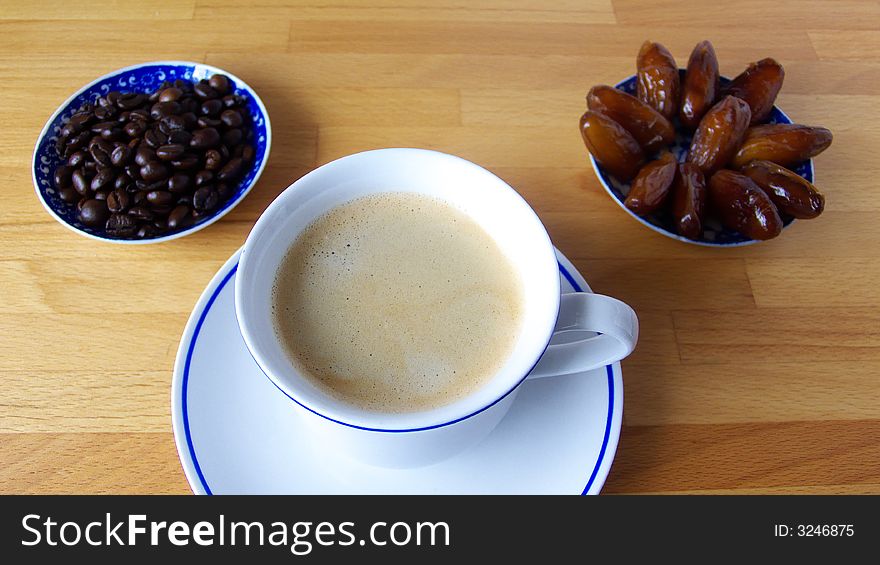 Cofe arranged with Dates and coffe beans. Cofe arranged with Dates and coffe beans