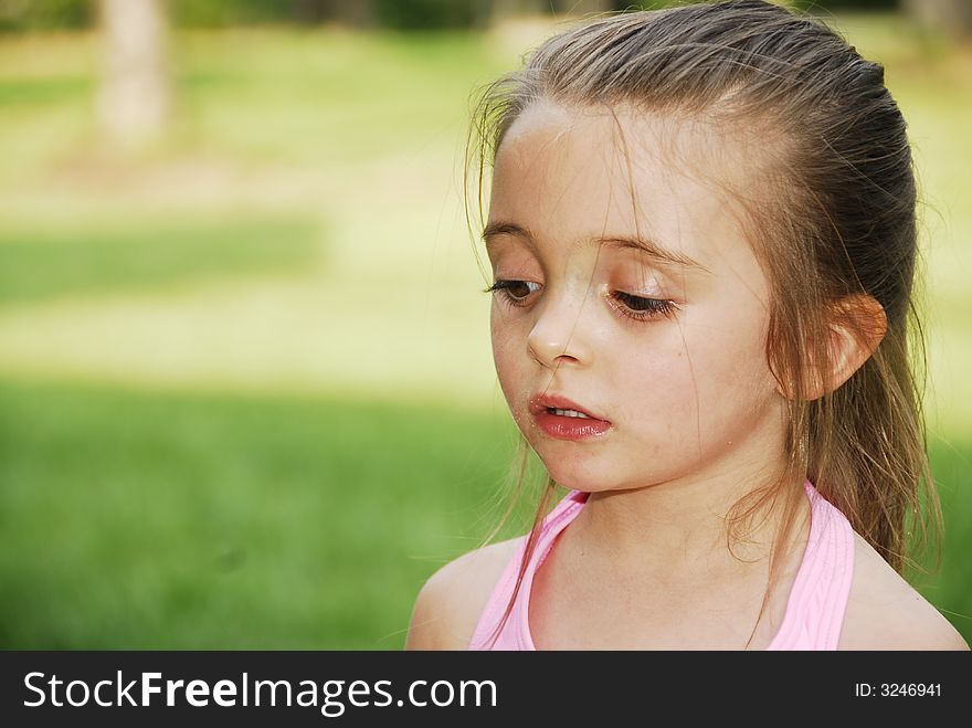 A brunette child looking very serious. A brunette child looking very serious.