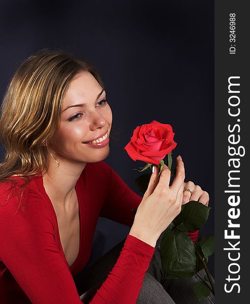 Beautiful young woman with rose