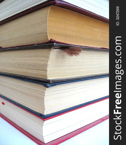 Pile of old books on a white background