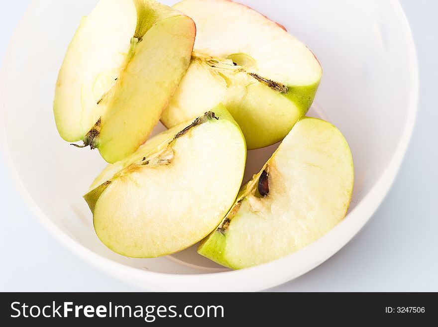 Apple pieces in a bowl.