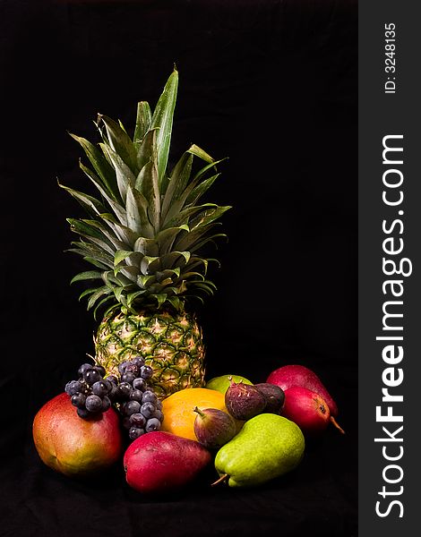 MIscellaneous colorful fresh fruits on dark background. MIscellaneous colorful fresh fruits on dark background