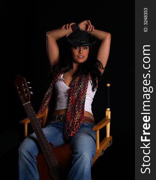 Beautiful latino rock chick with an acoustic guitar. Beautiful latino rock chick with an acoustic guitar