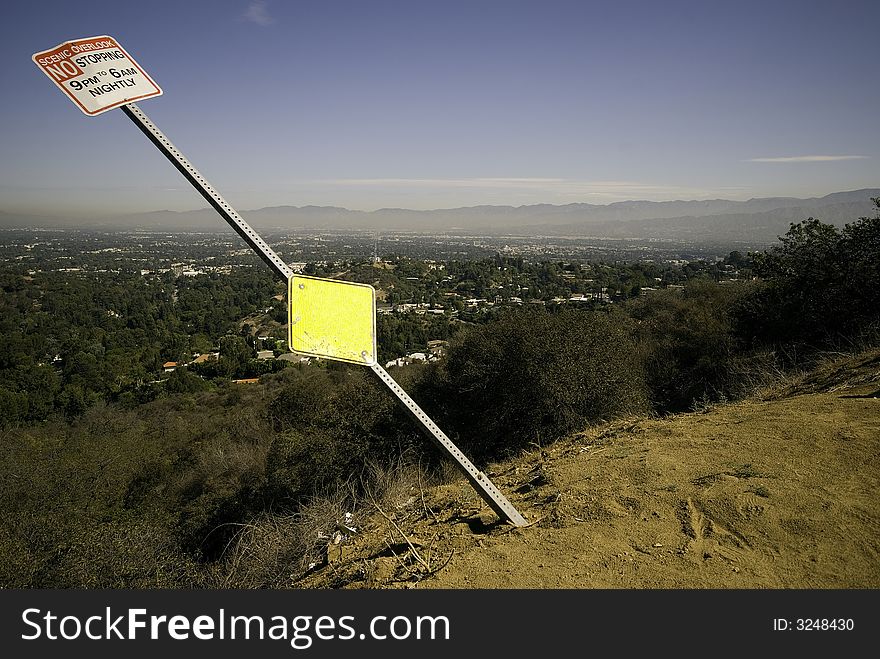 No Stopping Sign leans out over the edge