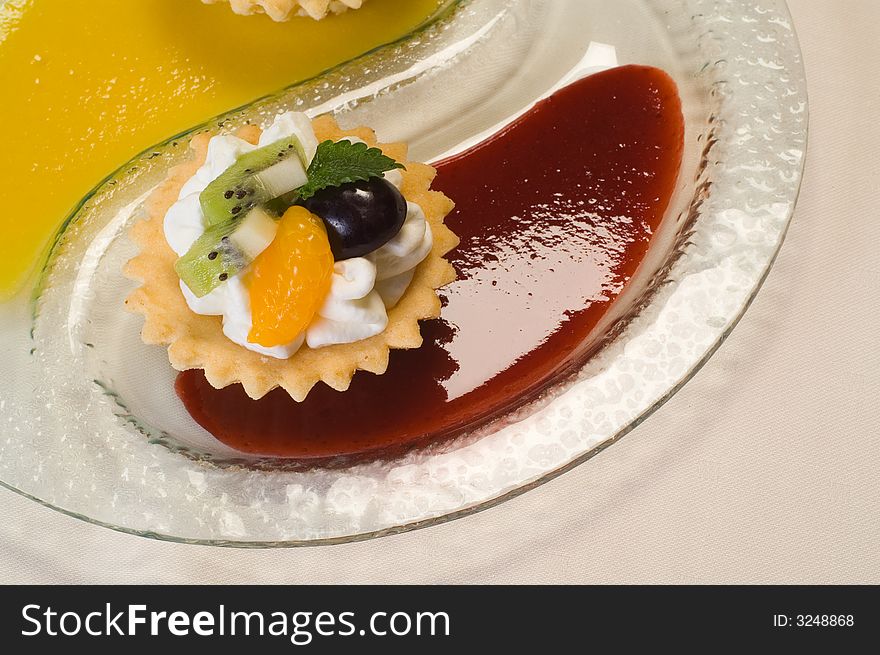 Butter cookie with whipped cream and fruit sauce