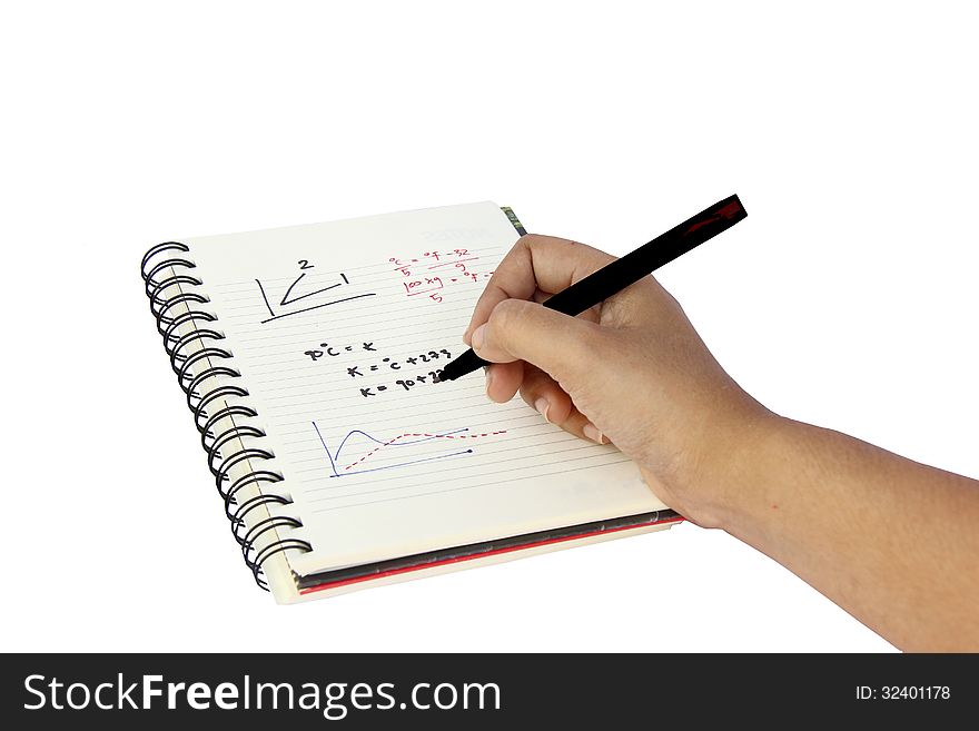 Hand is writing text on a book in white background. Hand is writing text on a book in white background.