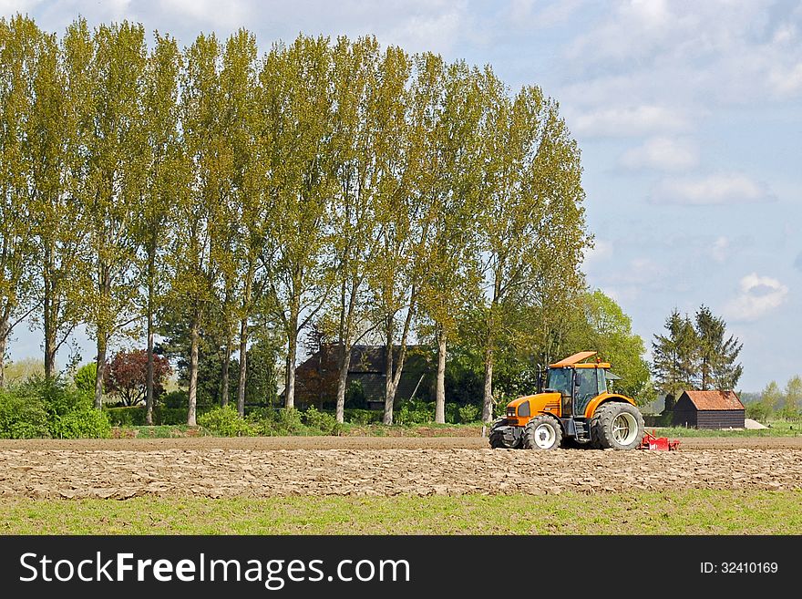 Farmer on a tractor in a field
