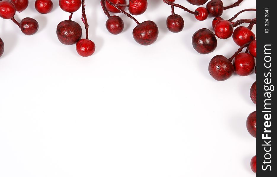 Christmas decoration from red berries isolated on white background