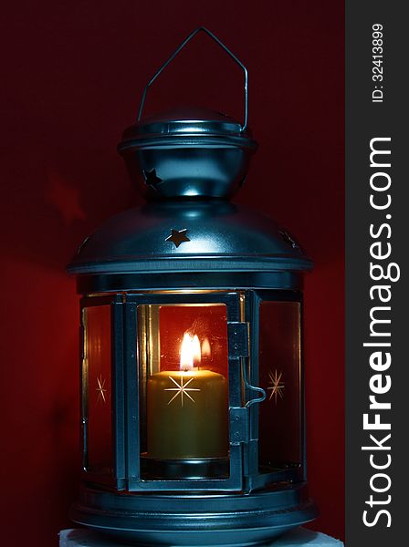 Old lantern with burning candle. Old lantern with burning candle