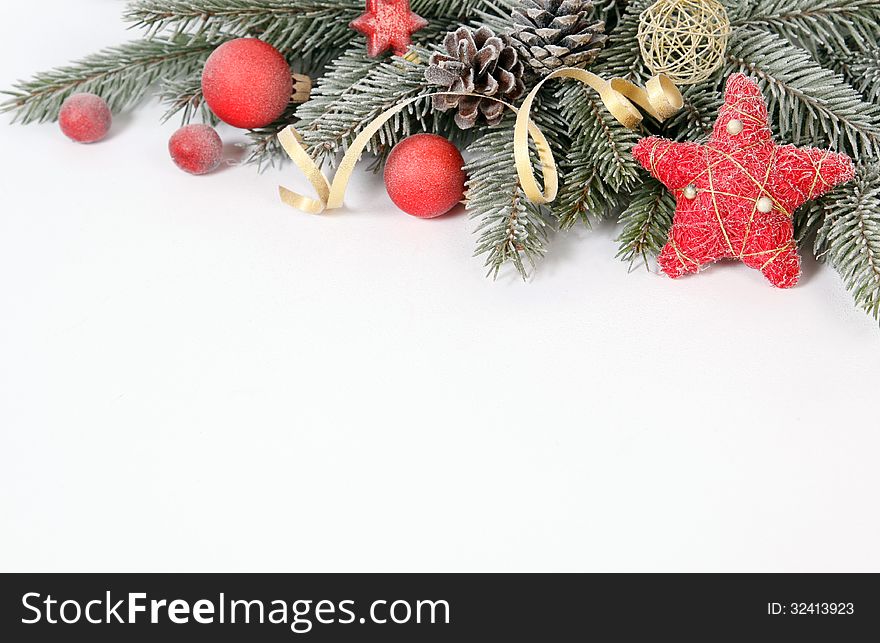 Christmas decoration with the twigs of the spruce and baubles