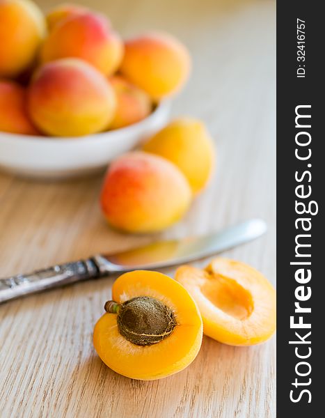 Ripe apricots on a wooden table