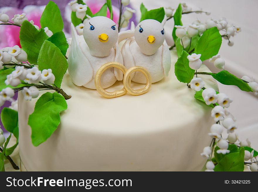 Decorating a wedding cake.