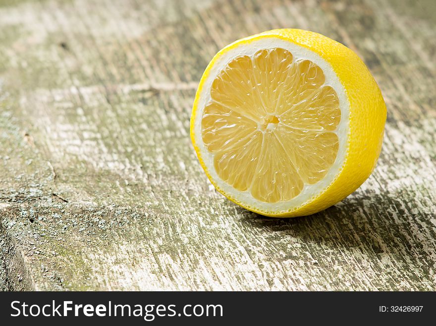 Lemon at old wood background
