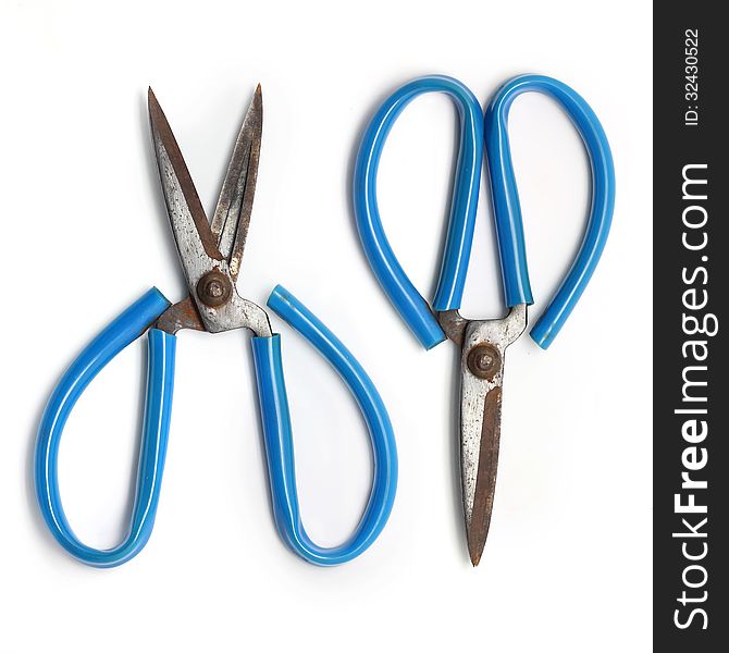 Old scissors isolated on white background