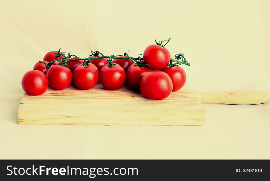 Cherry tomatoes isolated in vintage background