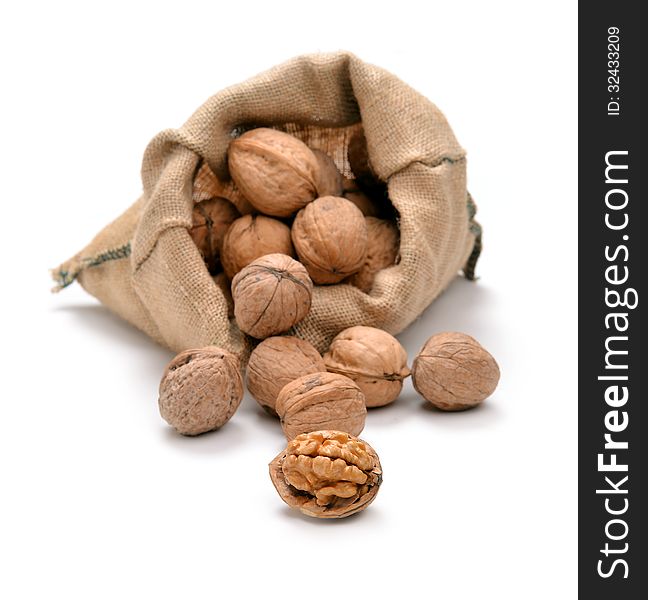 Walnuts and a bag on white