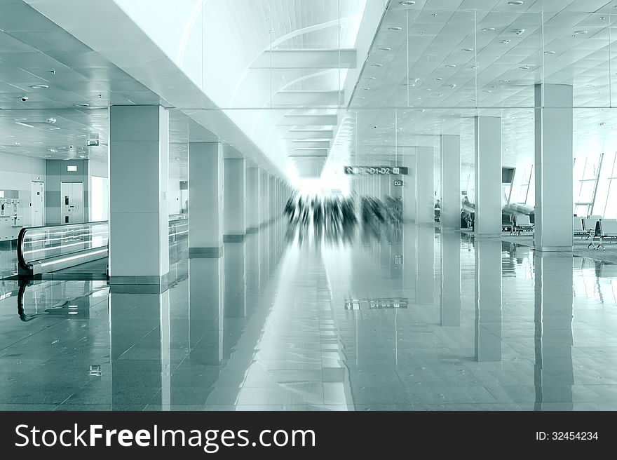 Travel concept. Passengers in the modern airport terminal waitin