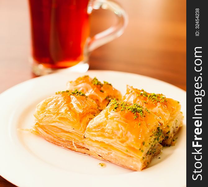 Oriental sweets baklava served with cup of tea